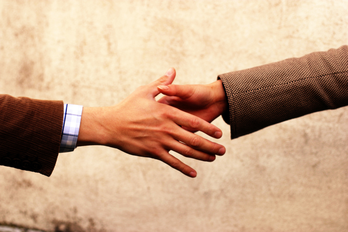 realtor shaking hands with client