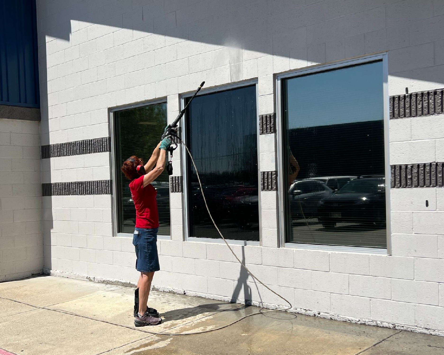 Red Day 2025 Jill pressure washing community building