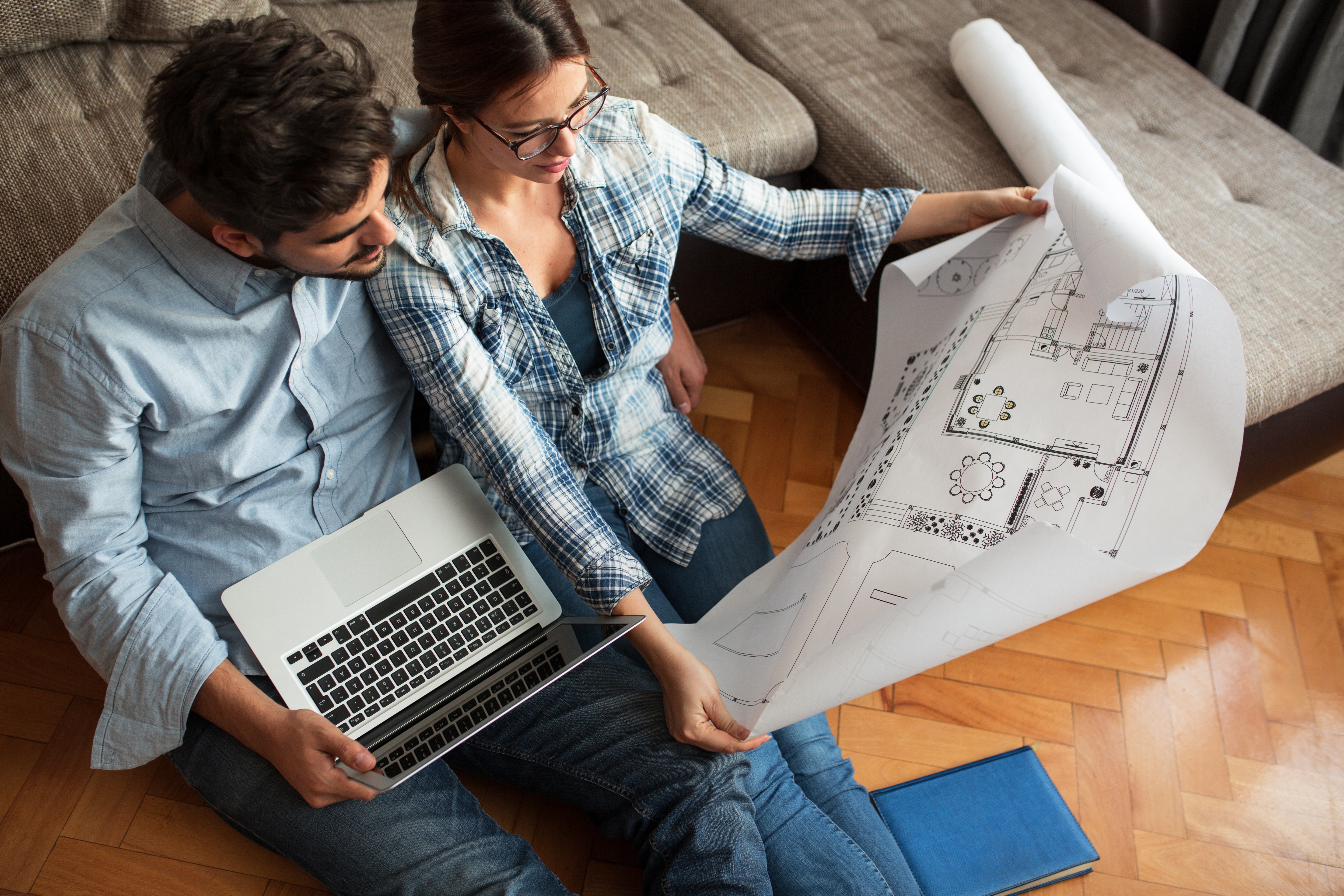 couple studying floor map