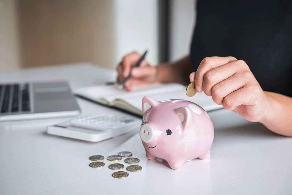 Putting pennies on a piggy bank