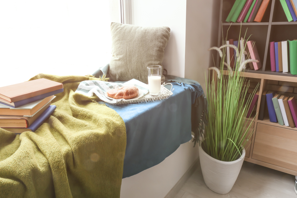 a table with a plant, food and books