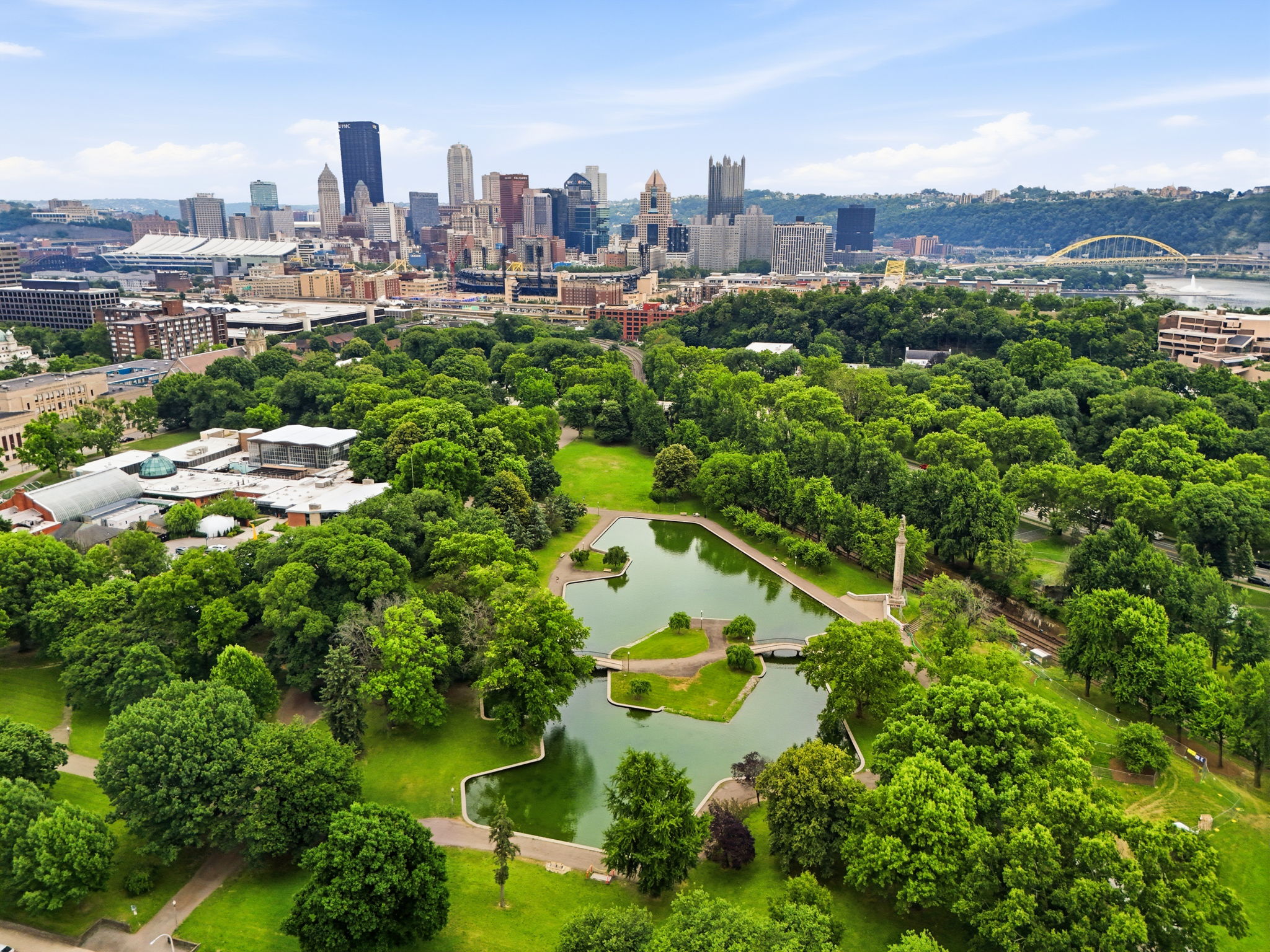Allegheny Commons Park with city skyline in the background