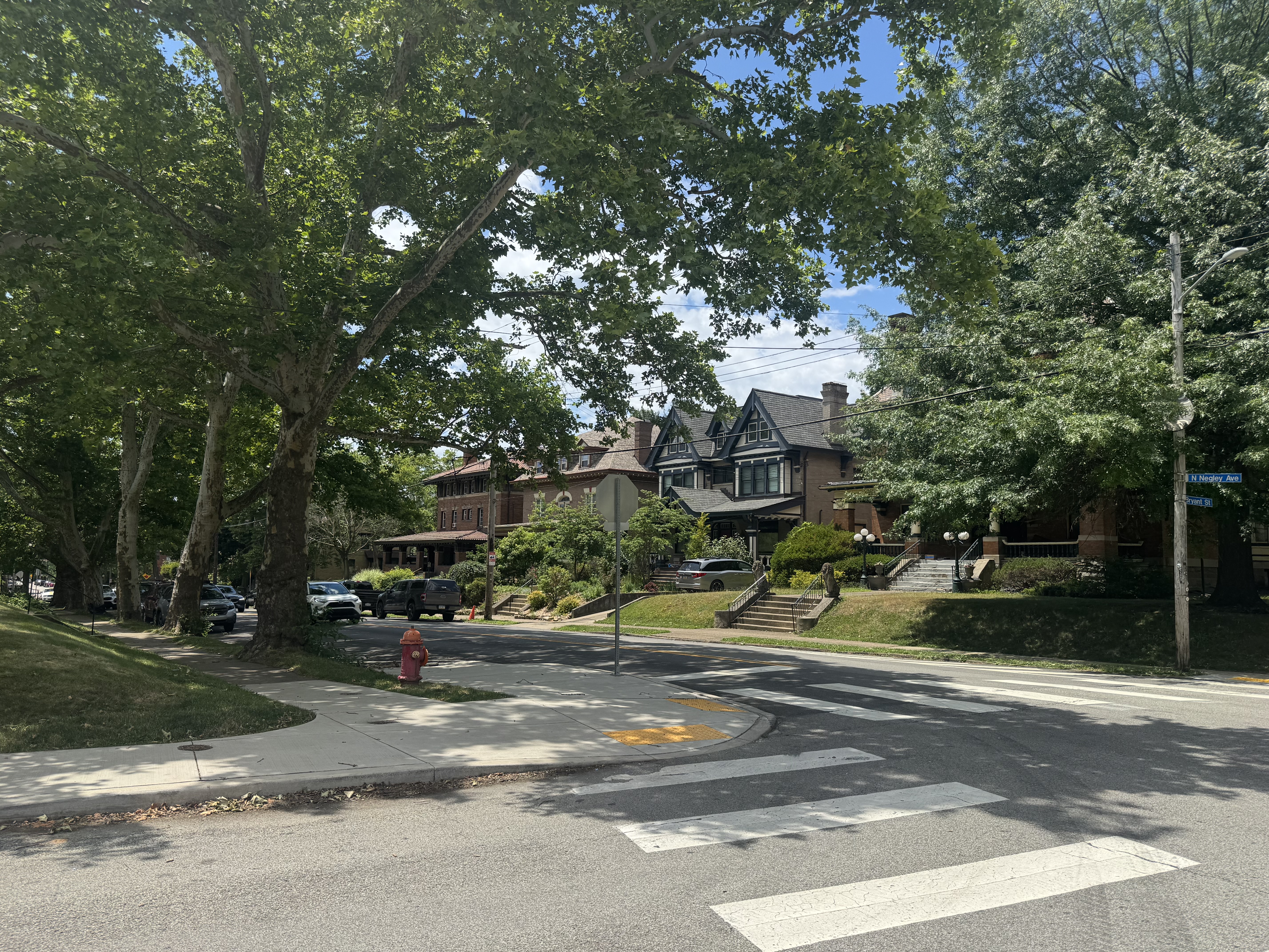 Grand historic homes on a leafy Highland Park street. Historic homes in Highland Park Pittsburgh neighborhood