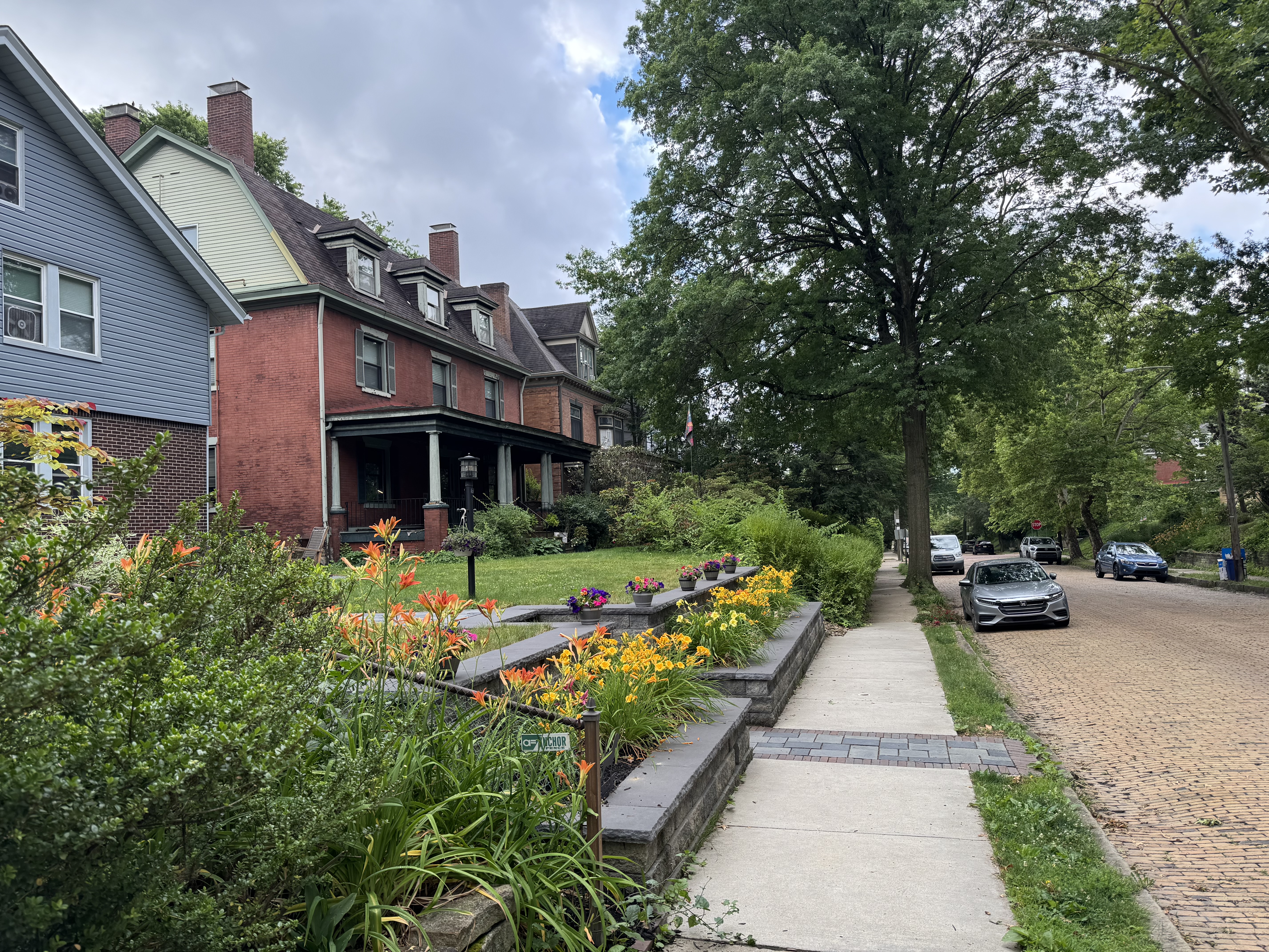 Alt: Porch-front homes in Regent Square Pittsburgh neighborhood