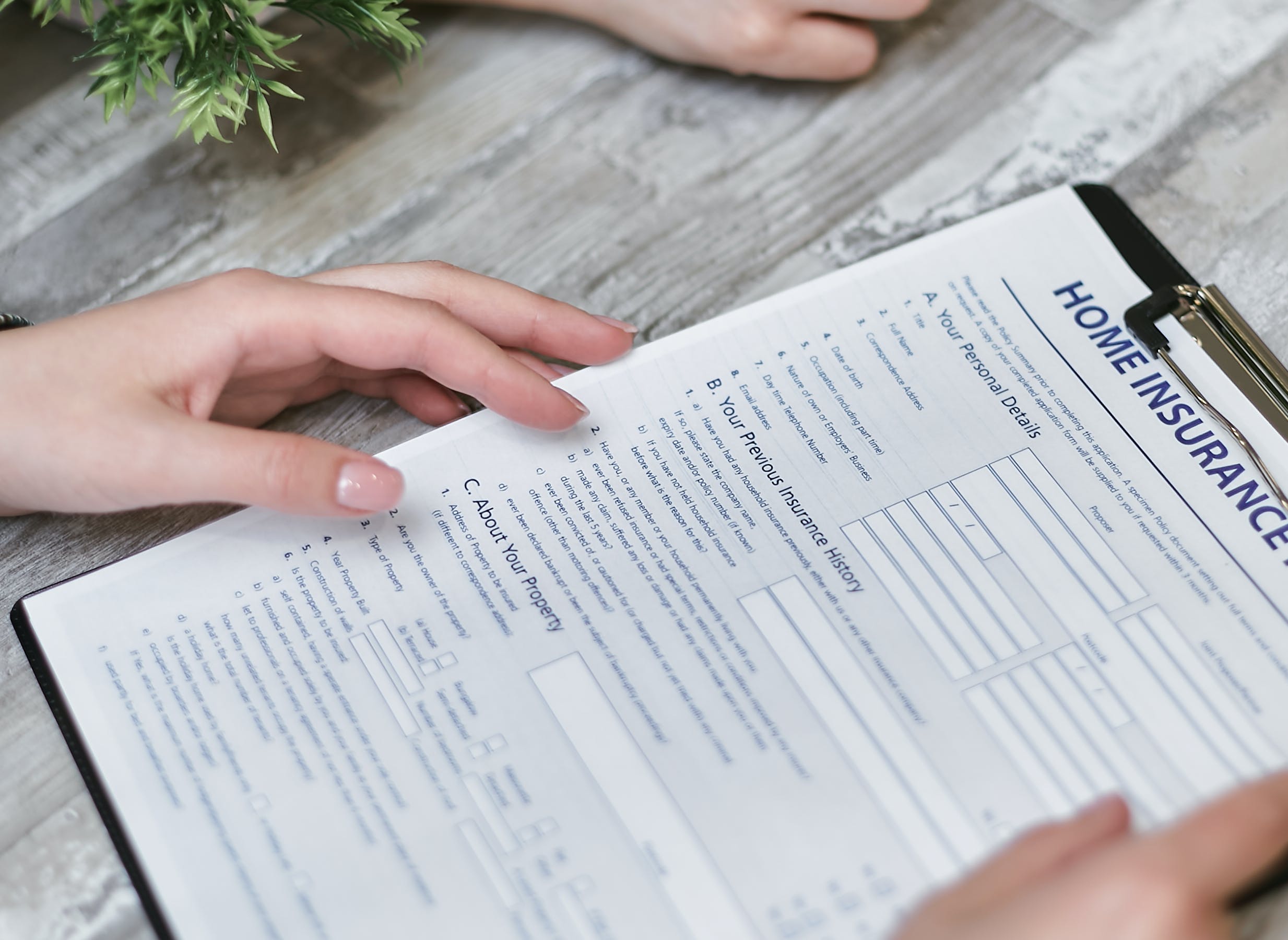 Filling-out-a-home-insurance-application-form Filling out a home insurance application form