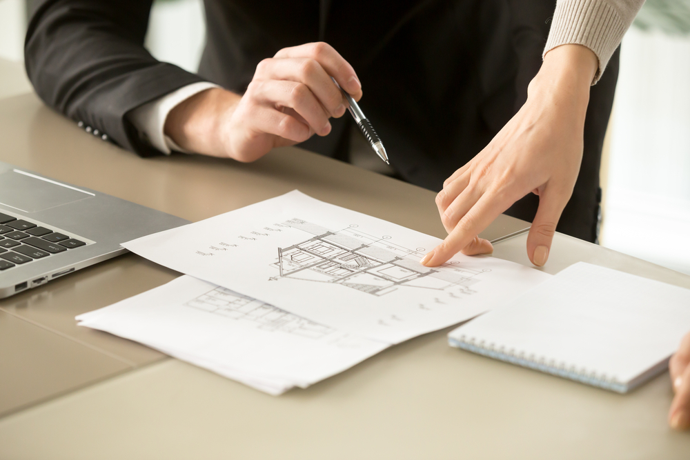 homebuyer-looking-at-floor-plan homebuyer looking at floor plan