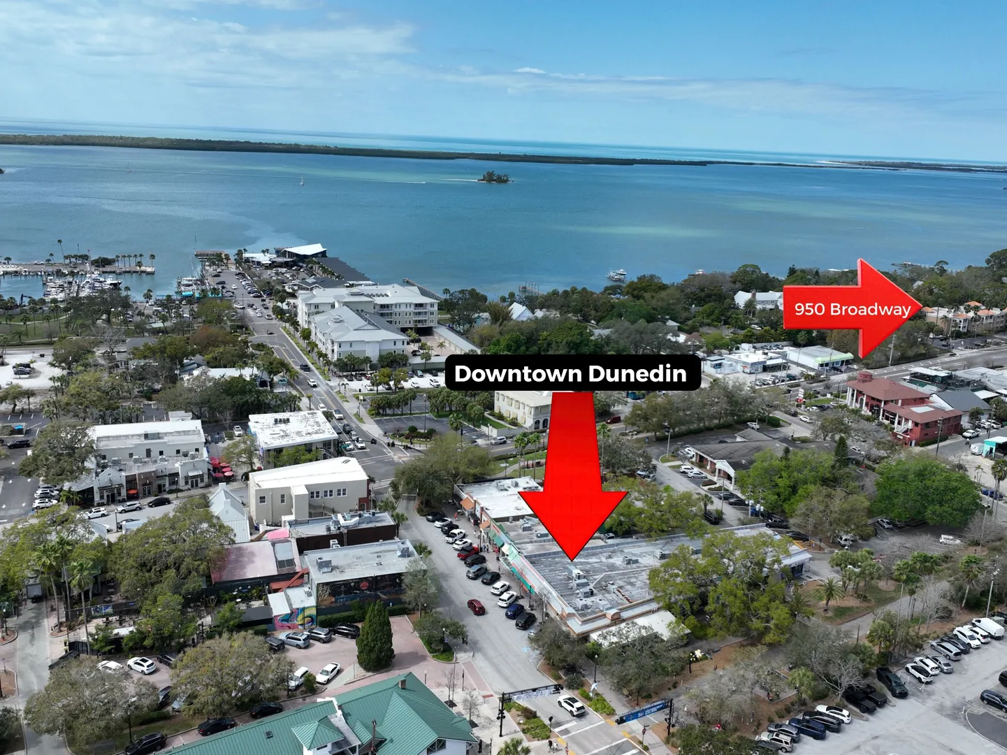 Drone aerial of Downtown Dunedin, Florida showing St. Joseph Sound and the location of the condo at 950 Broadway near the Dunedin waterfront.