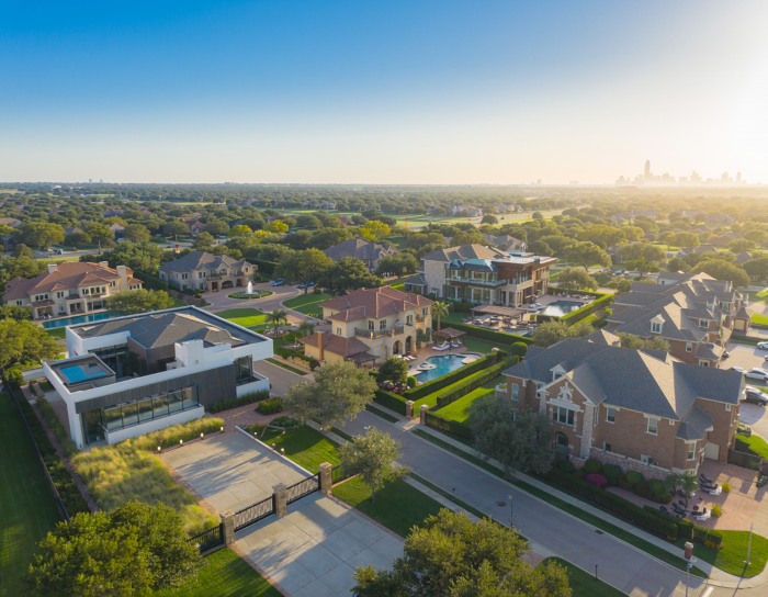 Dallas luxury real estate with historic homes and mature trees in an established neighborhood near White Rock Lake