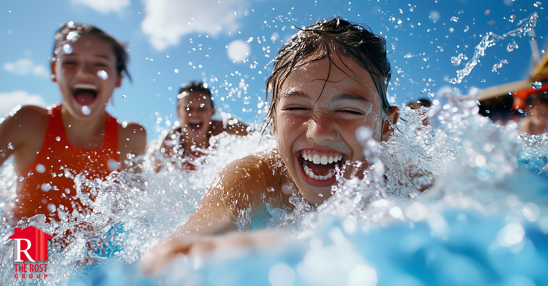 Teenagers swimming and splashing in a pool on a summer day in Kansas City