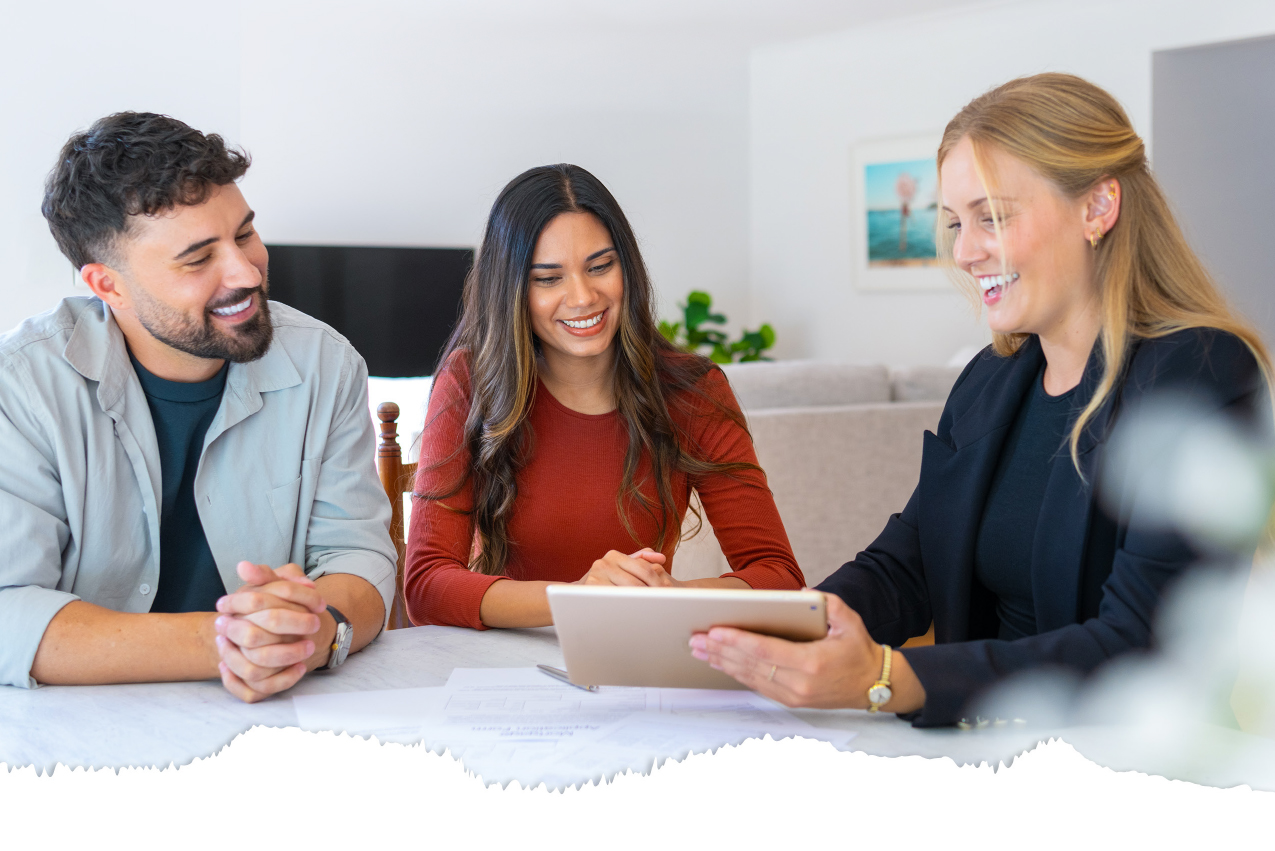 Kansas City homebuyers meeting with a real estate agent to discuss buying or selling a home
