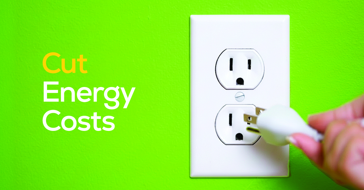 Hand unplugging an electrical cord from a wall outlet illustrating simple ways to reduce home energy costs.