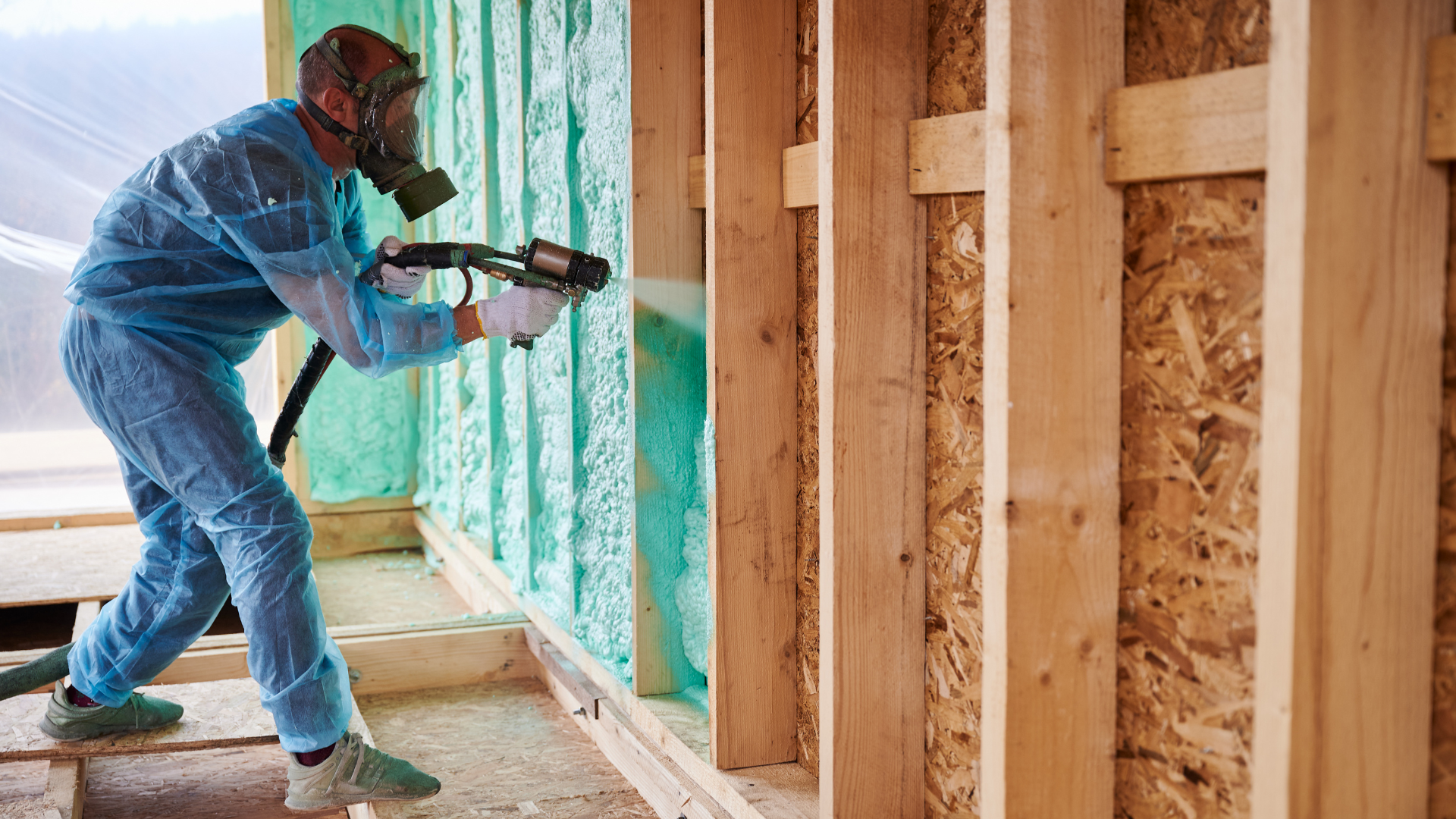 a man doing insulation