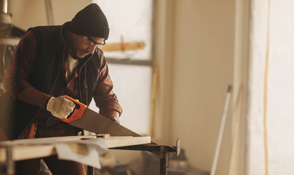 man working on reclaimed wood
