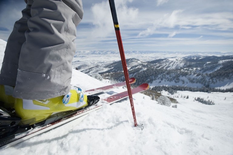 Skier preparing to descend a slope