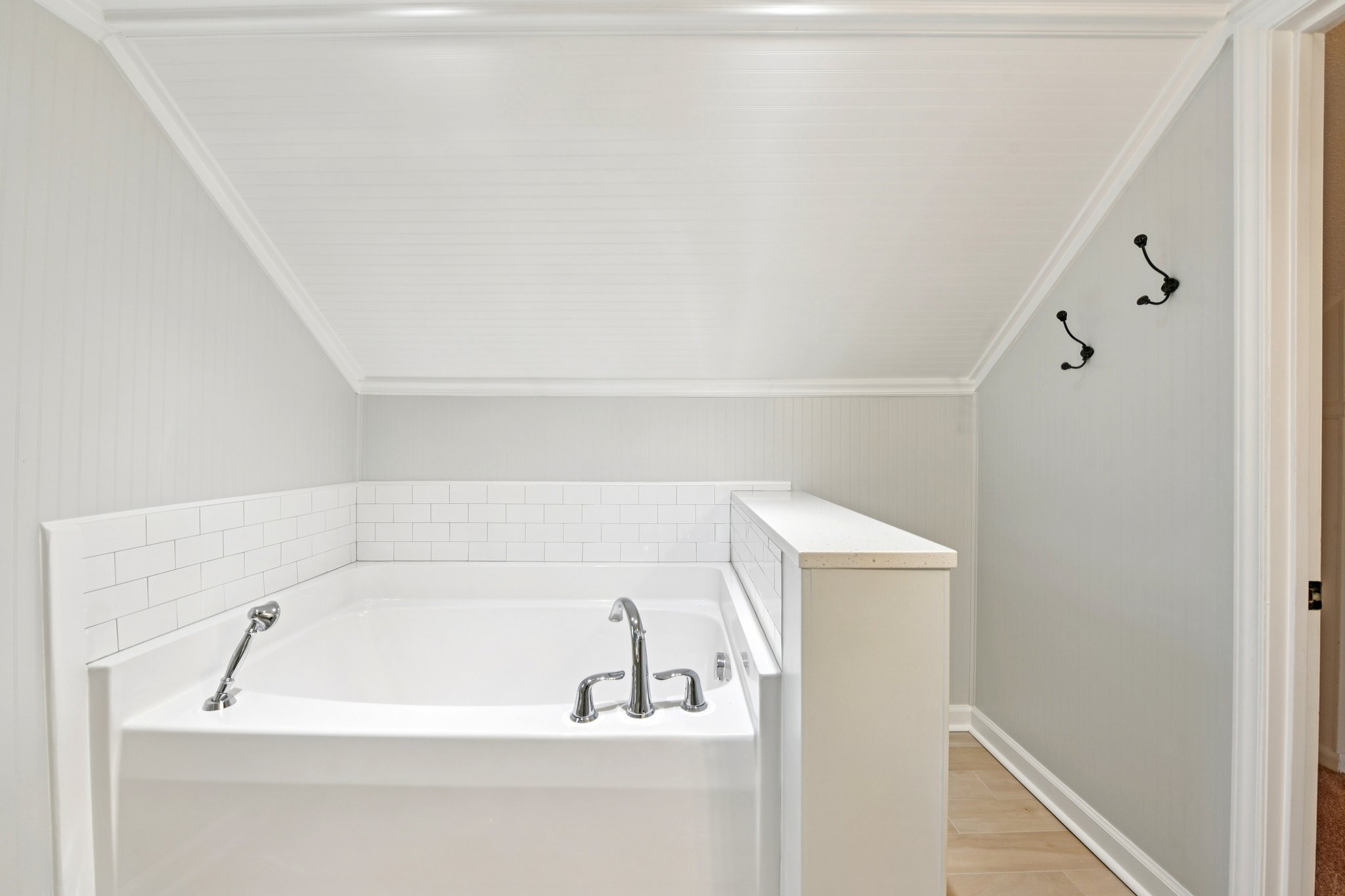 concord-nc-bungalow-primary-bath-renovated.jpg Renovated primary bathroom with tile shower and soaking tub in Concord NC historic bungalow.