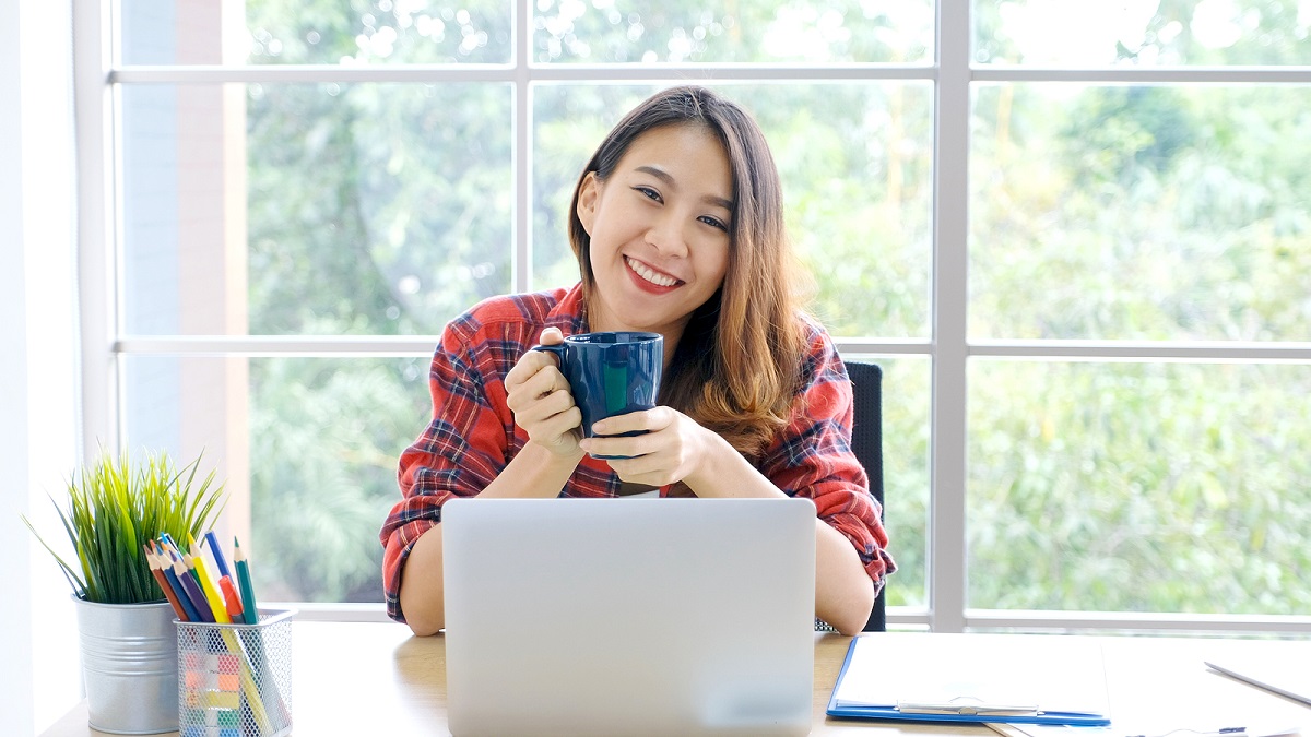 female with laptop in home office