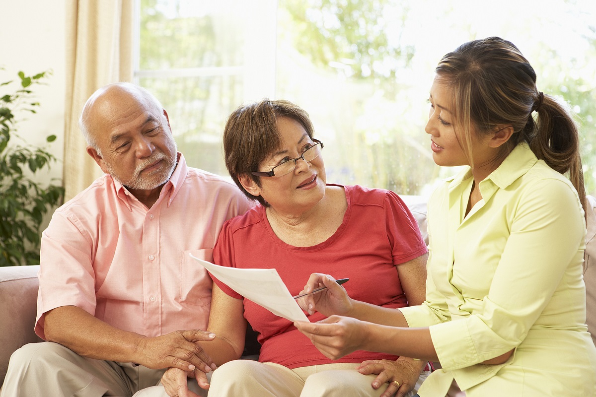 Agent discussing finances with senior couple