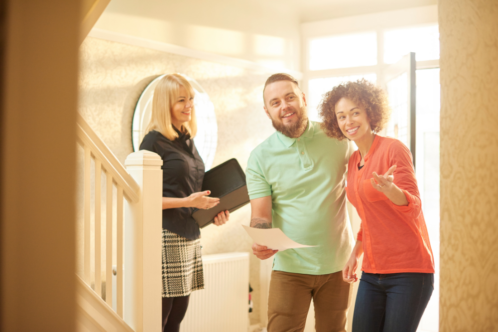 Realtor-and-a-couple-at-house-showings Realtor and a couple at house showings