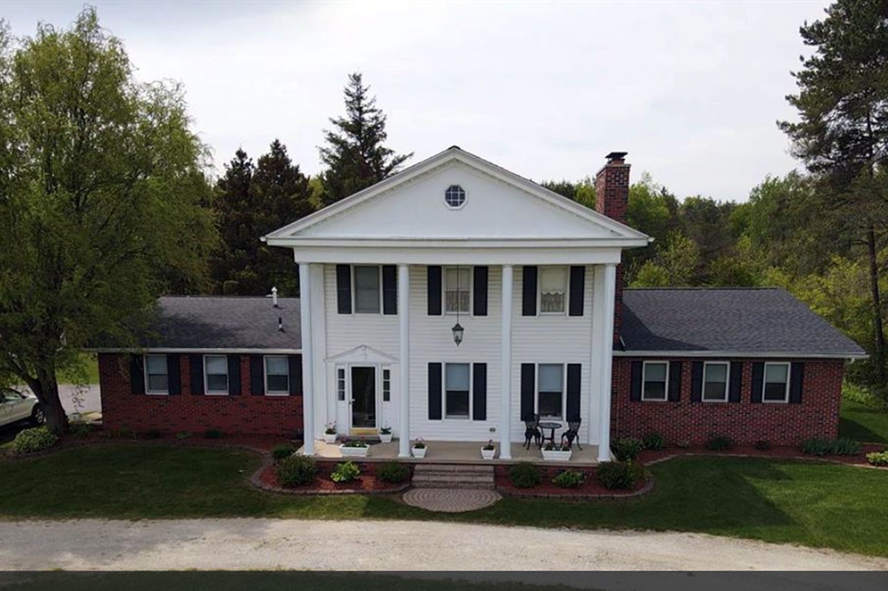 Two-Story Colonial-Style Home with Brick Siding and White Columns, Fort Gratiot Township, MI Real Estate