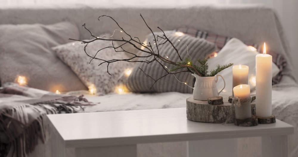 living room with candle light and cozy textiles