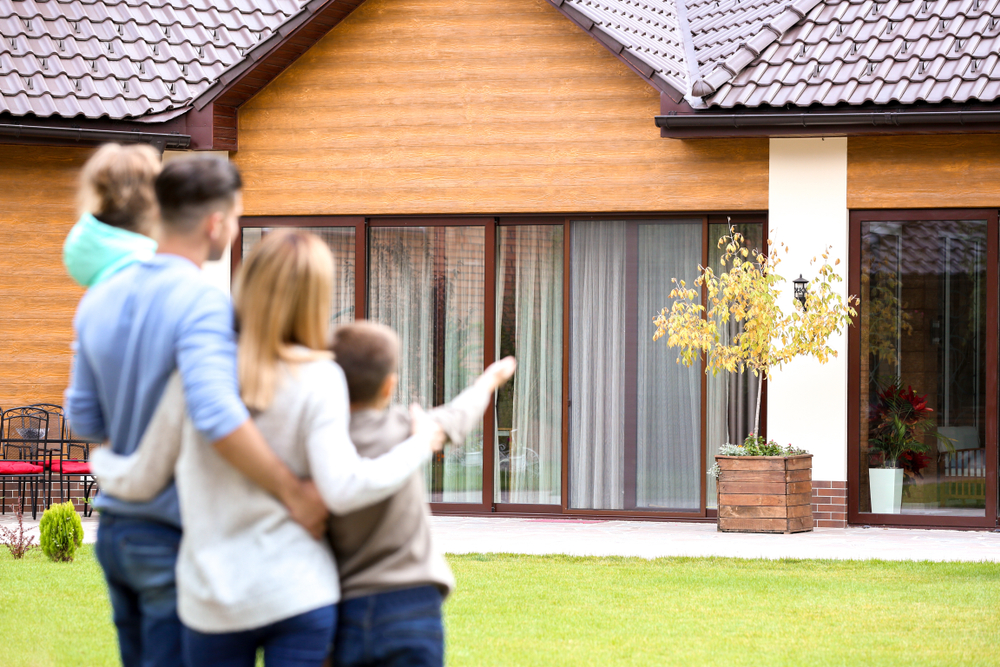 family looking at their new house