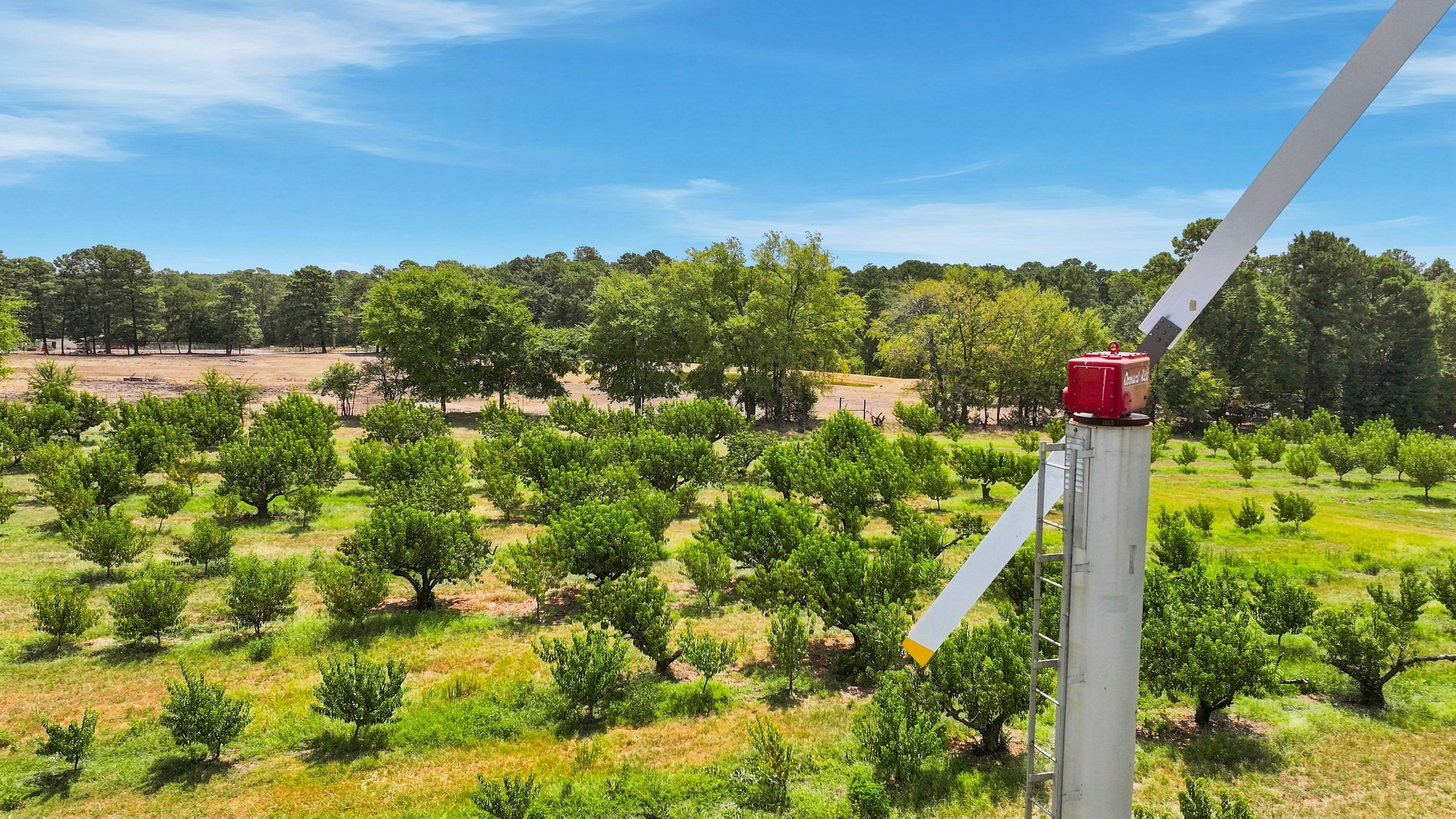 Orchard-Rite frost fan overlooking the peach orchard near Winona, Texas