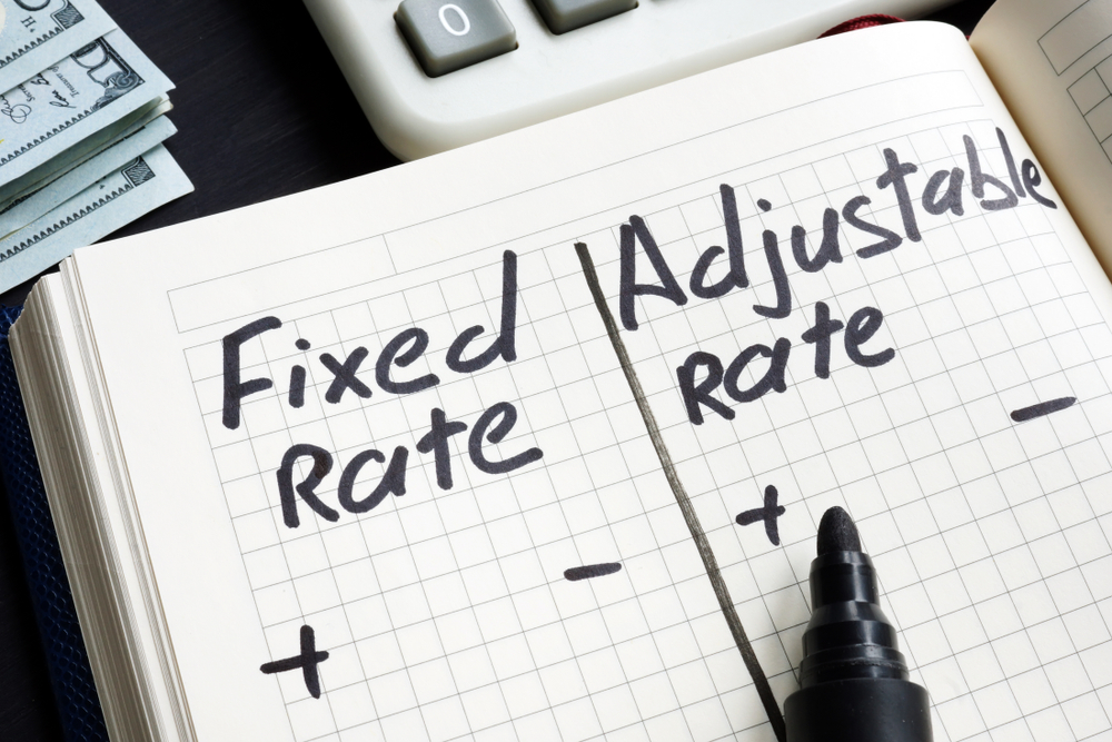 comparison of fixed rate and adjustable rate written on the notebook