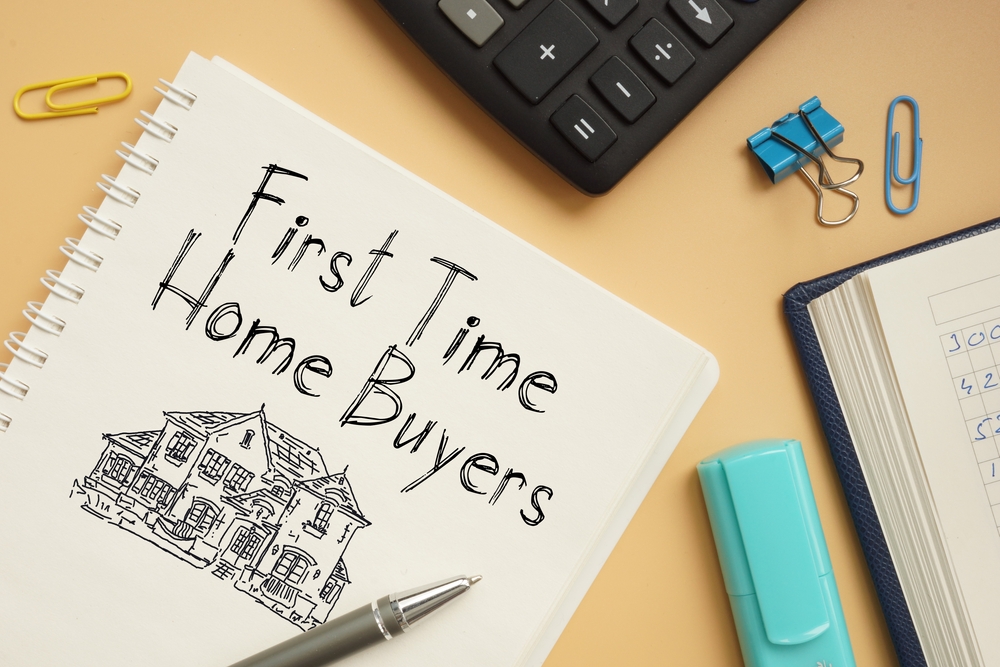 first time home buyers text handwritten on the notebook