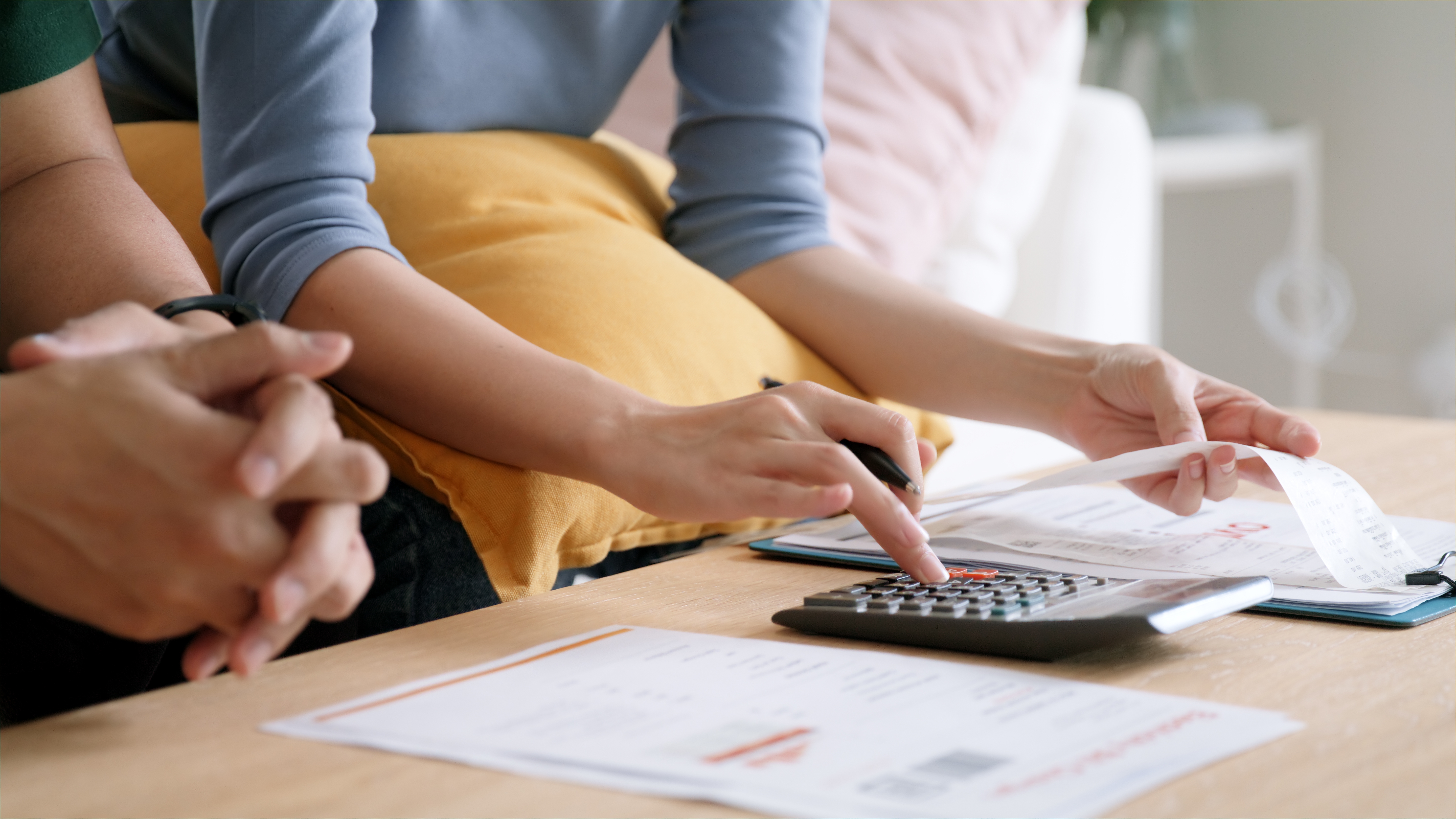 couple with pen and calculator taxes
