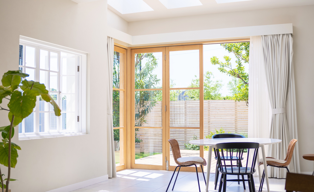 home with open windows for lighting