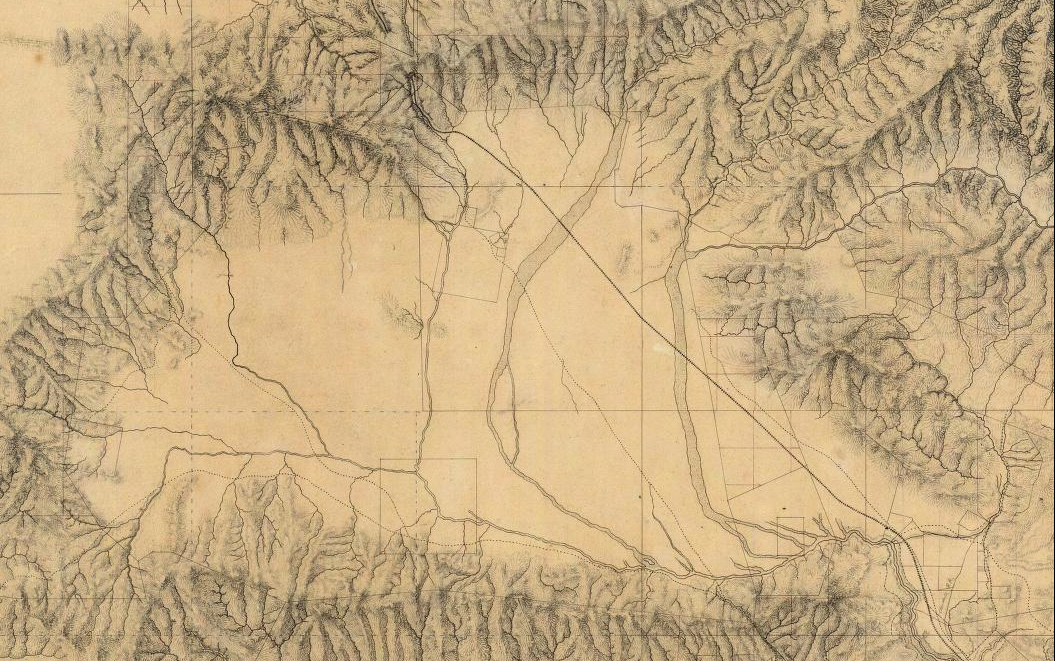 Historic map of the San Fernando Valley showing mountain ranges, open land, early roads, waterways and the Los Angeles basin.