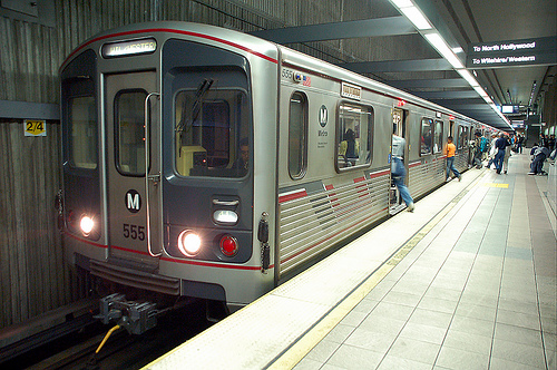 Metro train stopped at the Wilshire Western station platform in Koreatown.