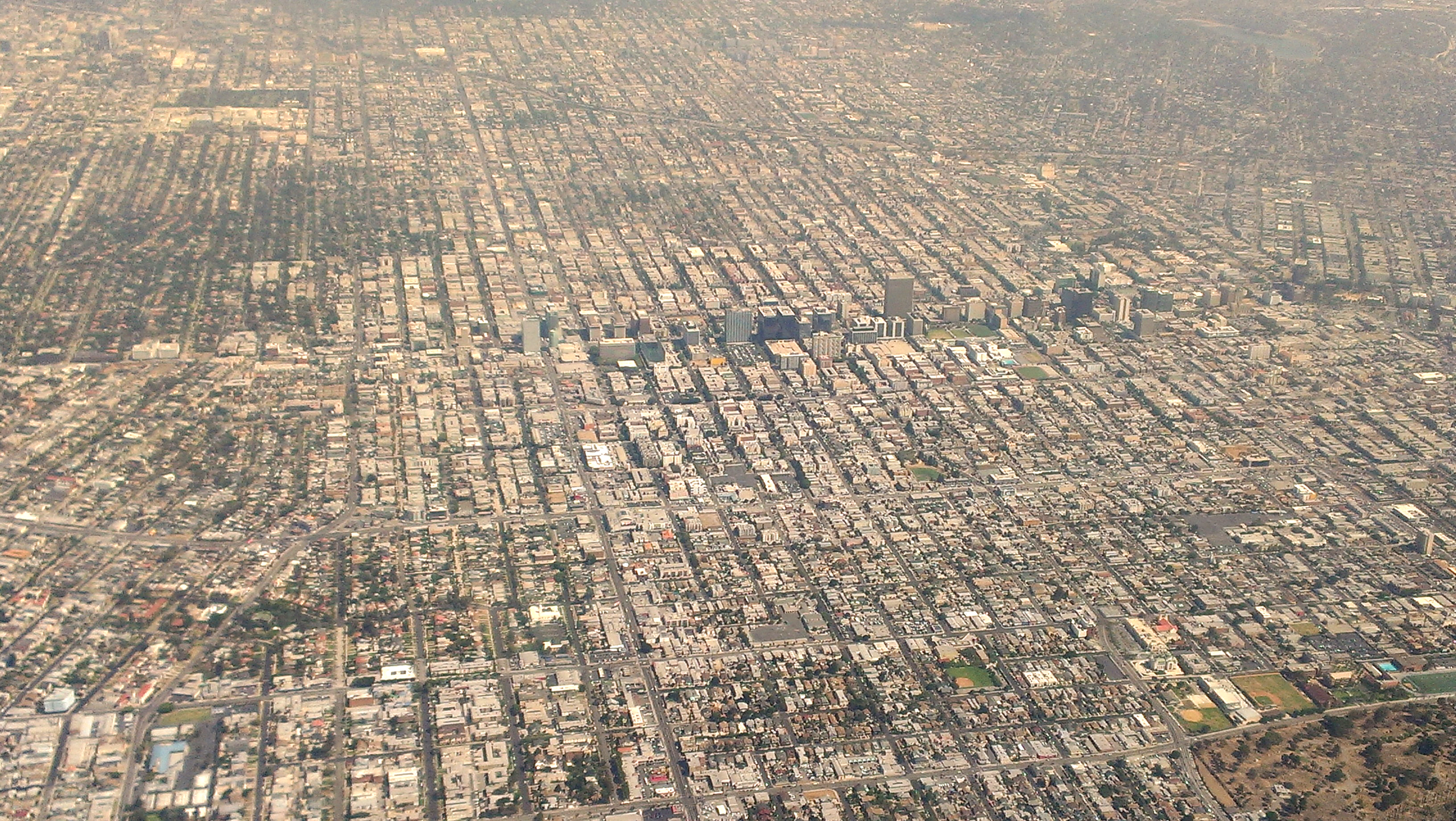 Aerial view of Koreatown in Los Angeles showing dense blocks, Wilshire Boulevard and central city development.