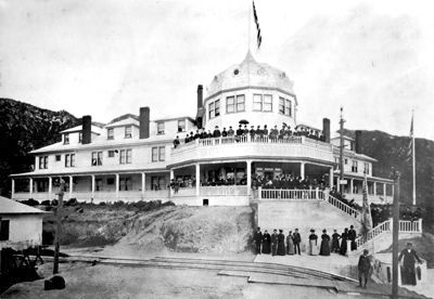 Historic photograph of Echo Mountain House with people gathered on the porch and stairs.