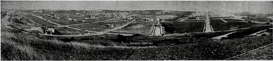 Early development in Pacific Palisades, when the community was still taking shape above the coast Black-and-white panoramic photograph of early Pacific Palisades development on the bluffs, with roads, open land and the coastline visible.