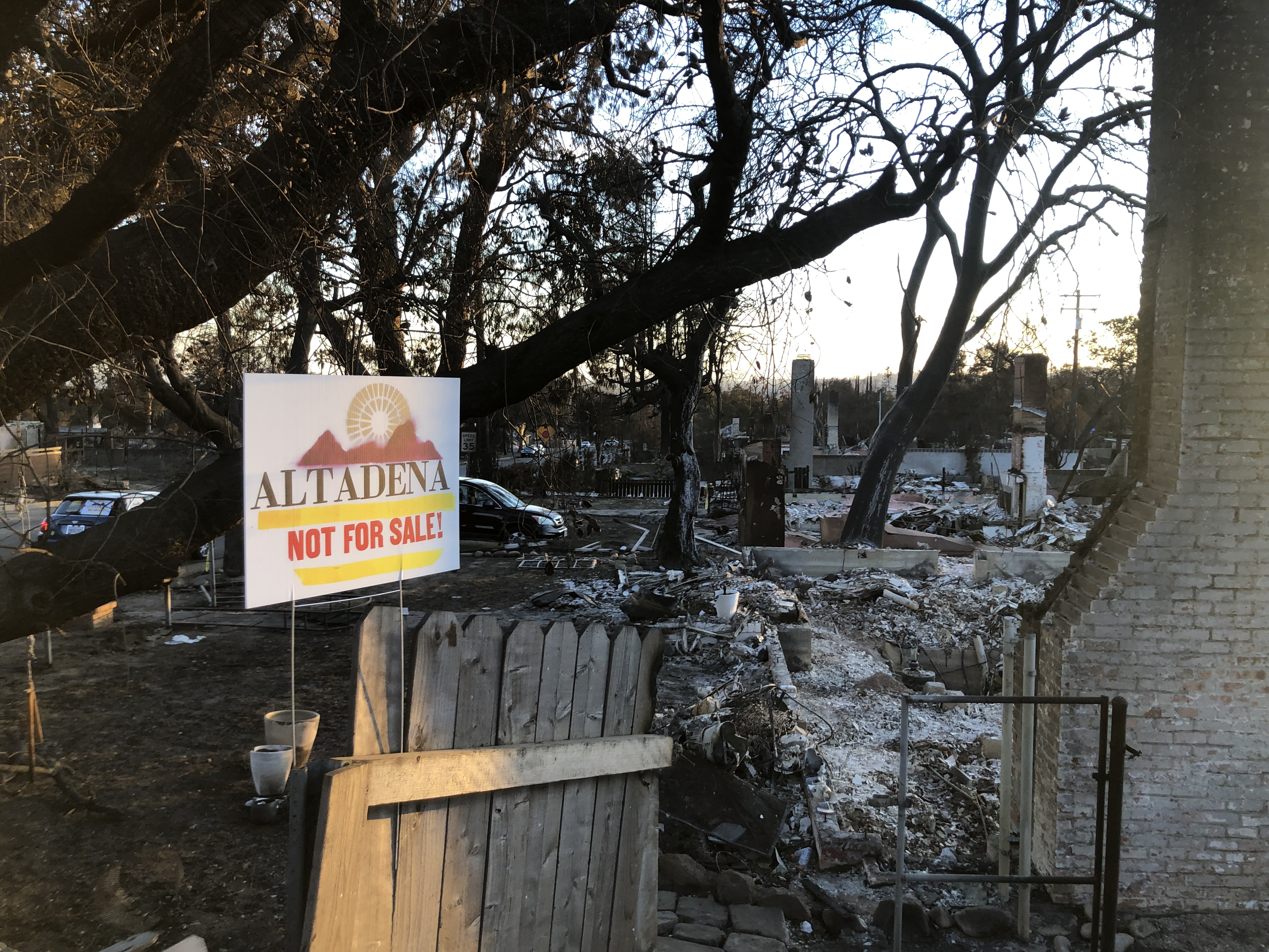 Altadena Not For Sale sign in front of a burned residential property after the Eaton Fire.