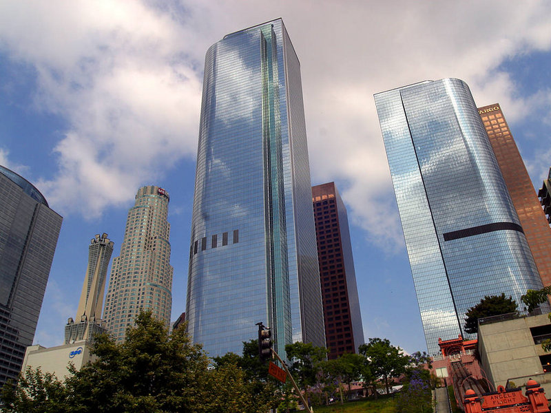 Downtown Los Angeles skyline with modern glass office towers rising above the city near Grand Central Market.