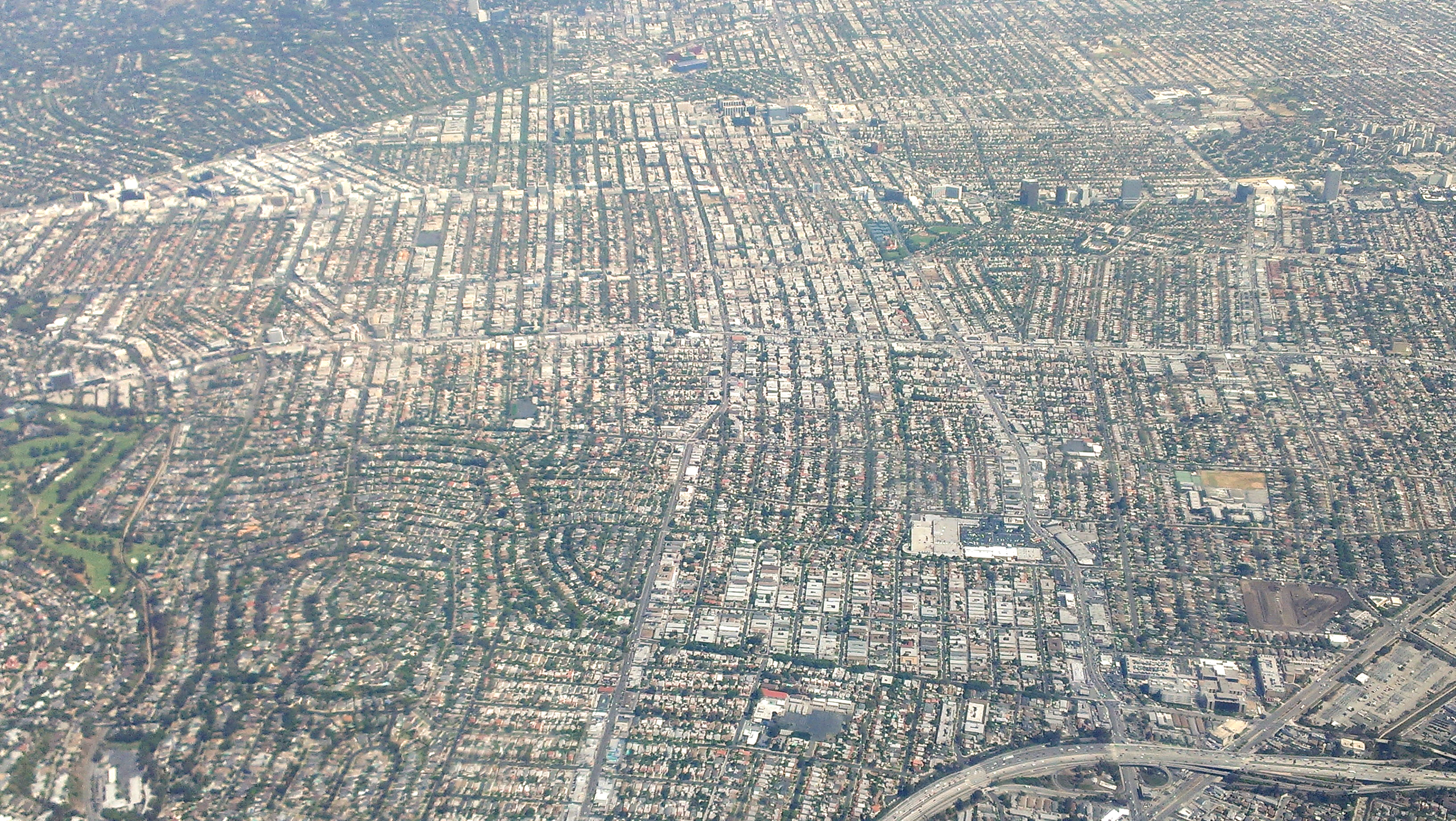  Aerial view showing the Wilshire Corridor and surrounding Los Angeles neighborhoods.