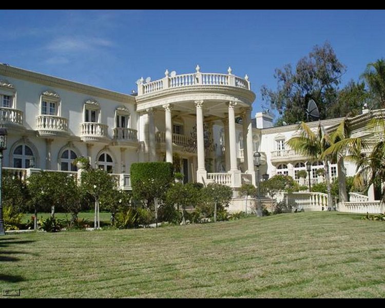 Grand Bel Air mansion with formal columns, lawn and classical architectural details.