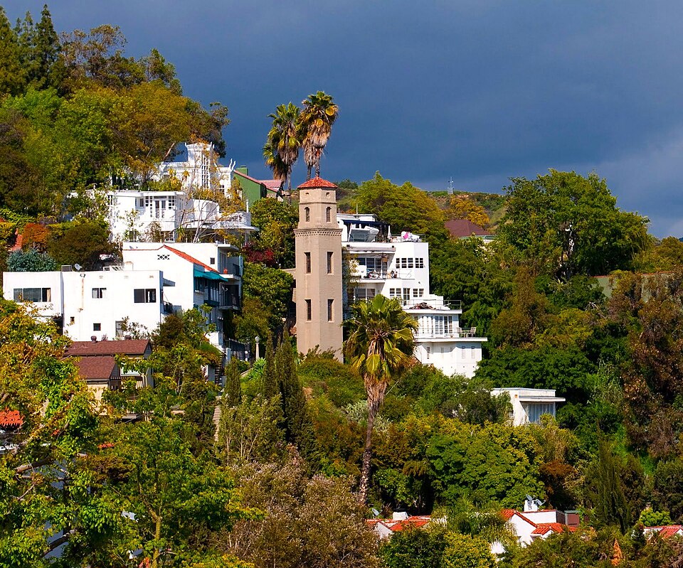 High Tower elevator rising above hillside homes in Hollywood Heights Los Angeles.