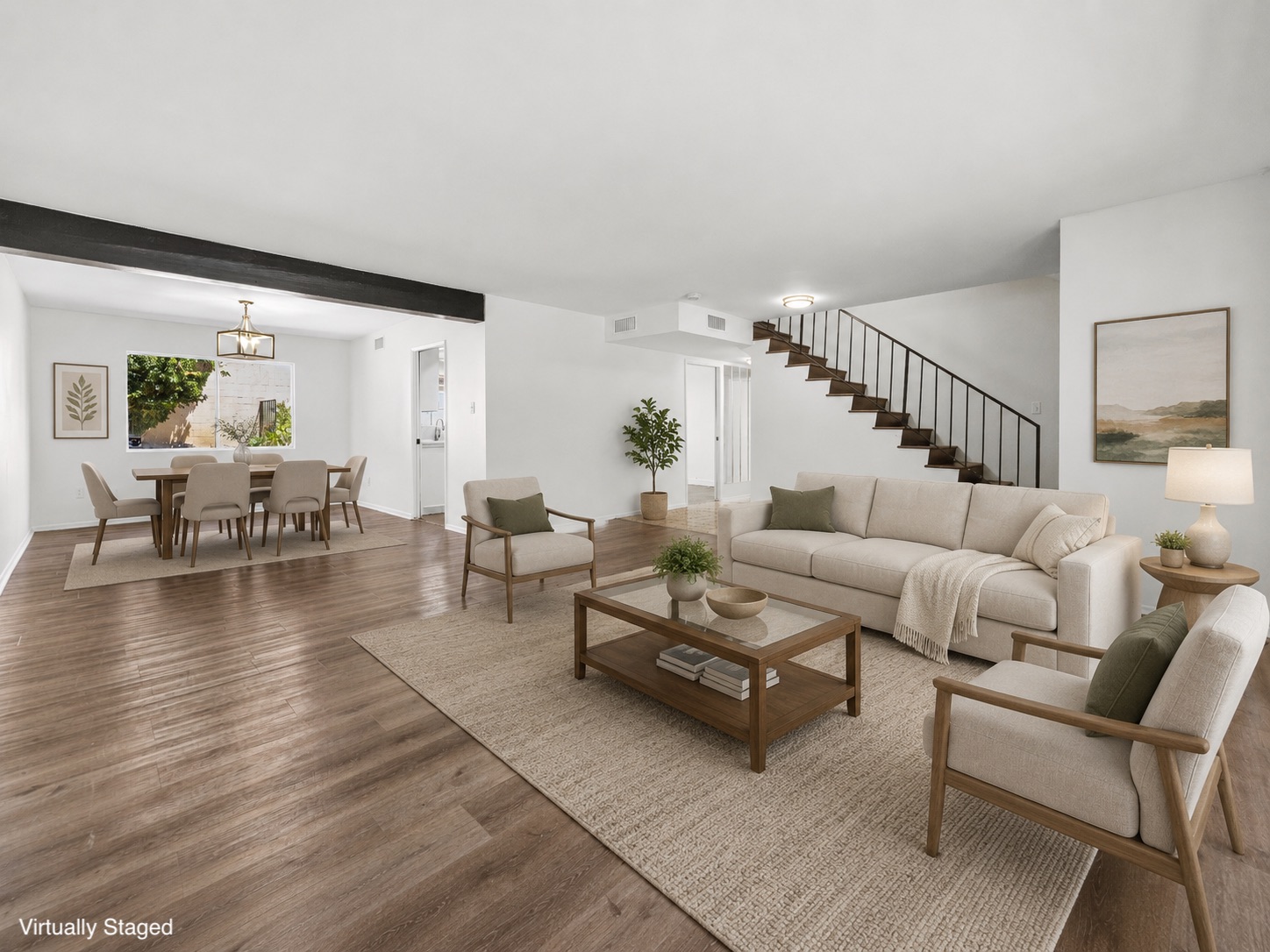 Family room with brick fireplace and sliding glass doors opening to the backyard at 6741 Buffalo Avenue in Valley Glen, CA.