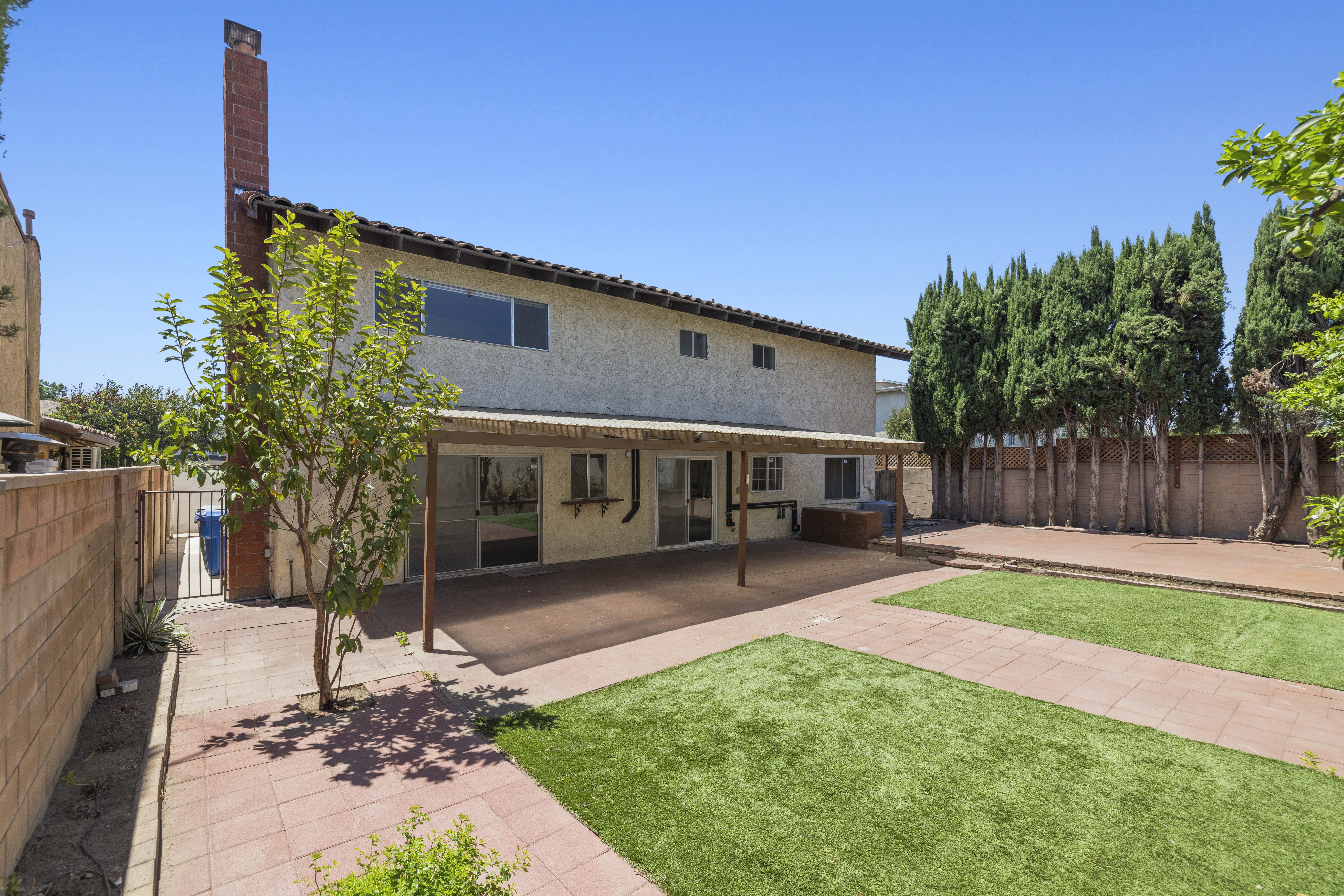 Backyard with open-beam covered patio and generous outdoor space at 6741 Buffalo Avenue in Valley Glen, California.