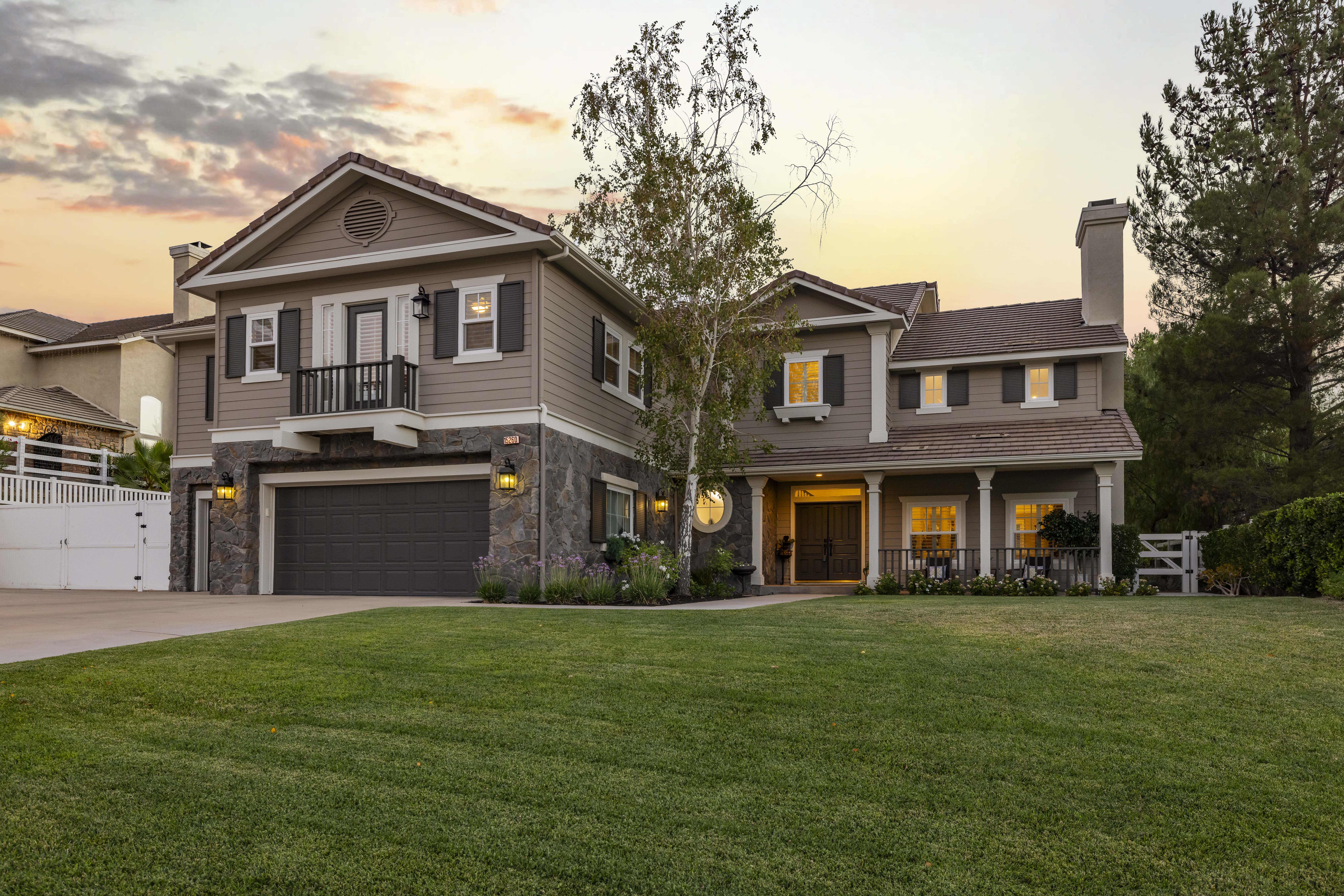 Front exterior of 15260 Saddleback Rd, Santa Clarita, CA 91387, a 4-bedroom, 4-bathroom home with 4,021 sq ft and over $200,000 in recent upgrades in the Ridgecrest tract of Sand Canyon. Sold by The Kathy Watterson Team at RE/MAX of Santa Clarita.