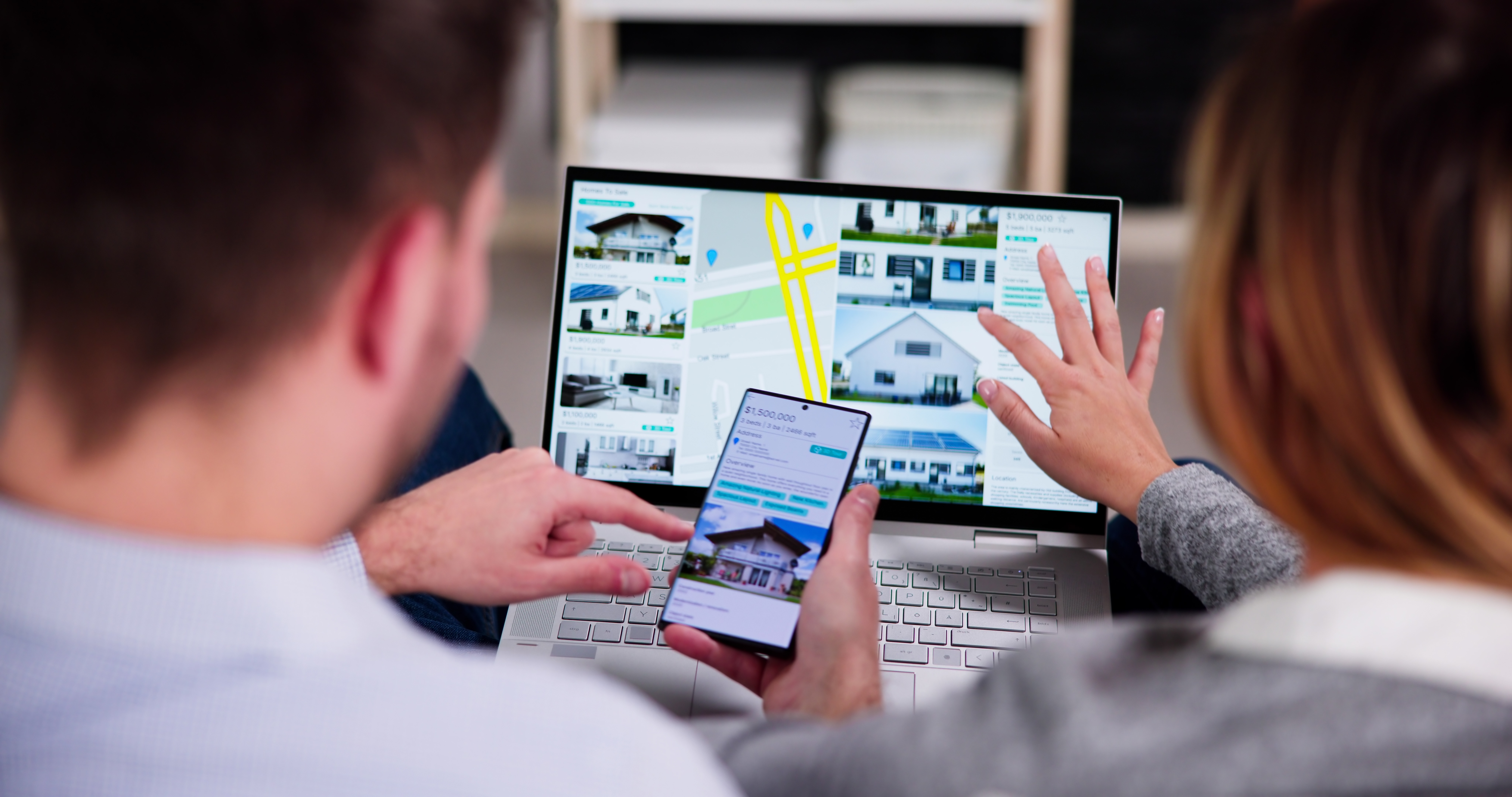 couple searching homes online