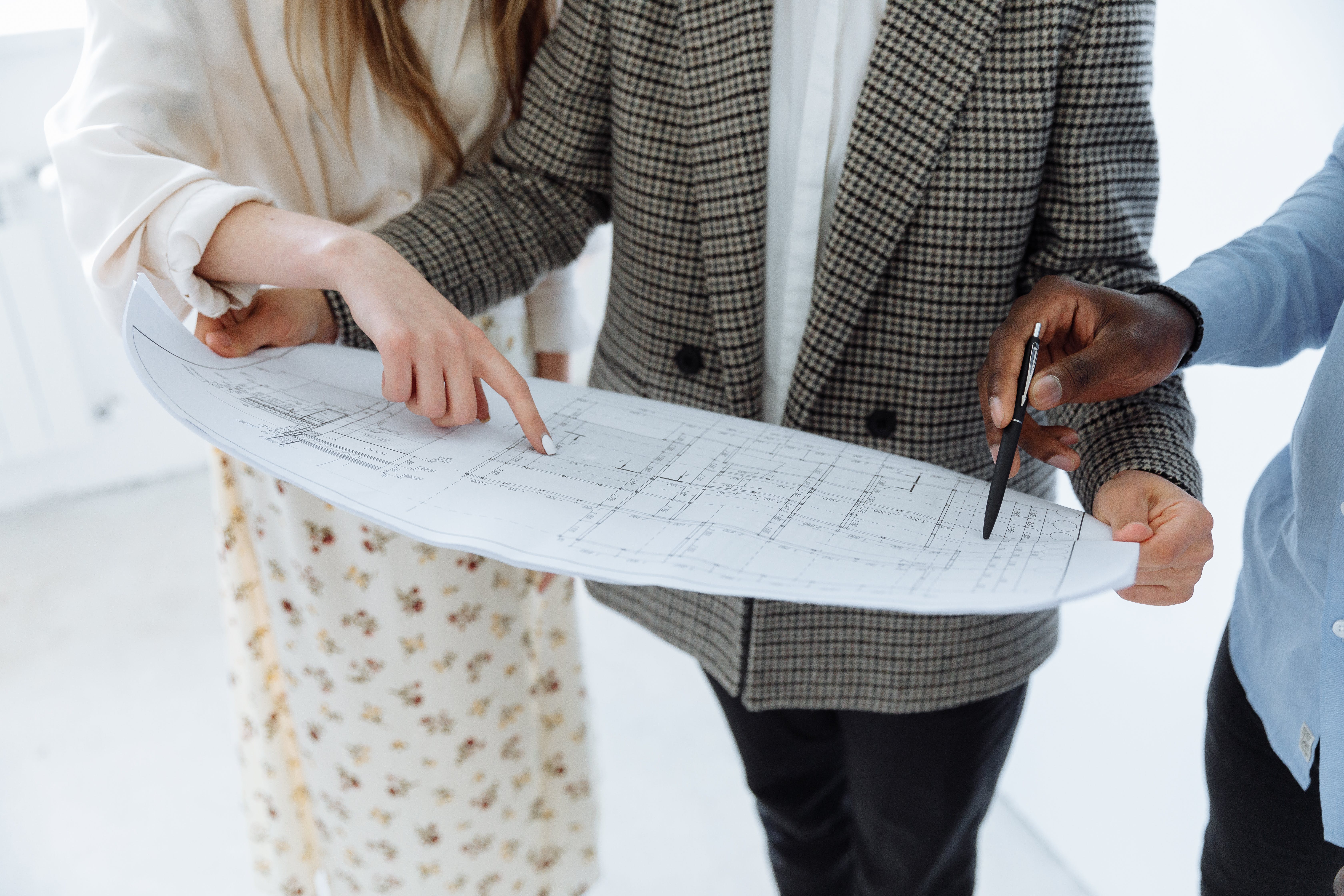 Inspecting floor plan with a professional