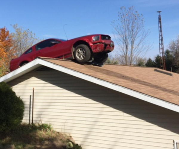 Car on top of house