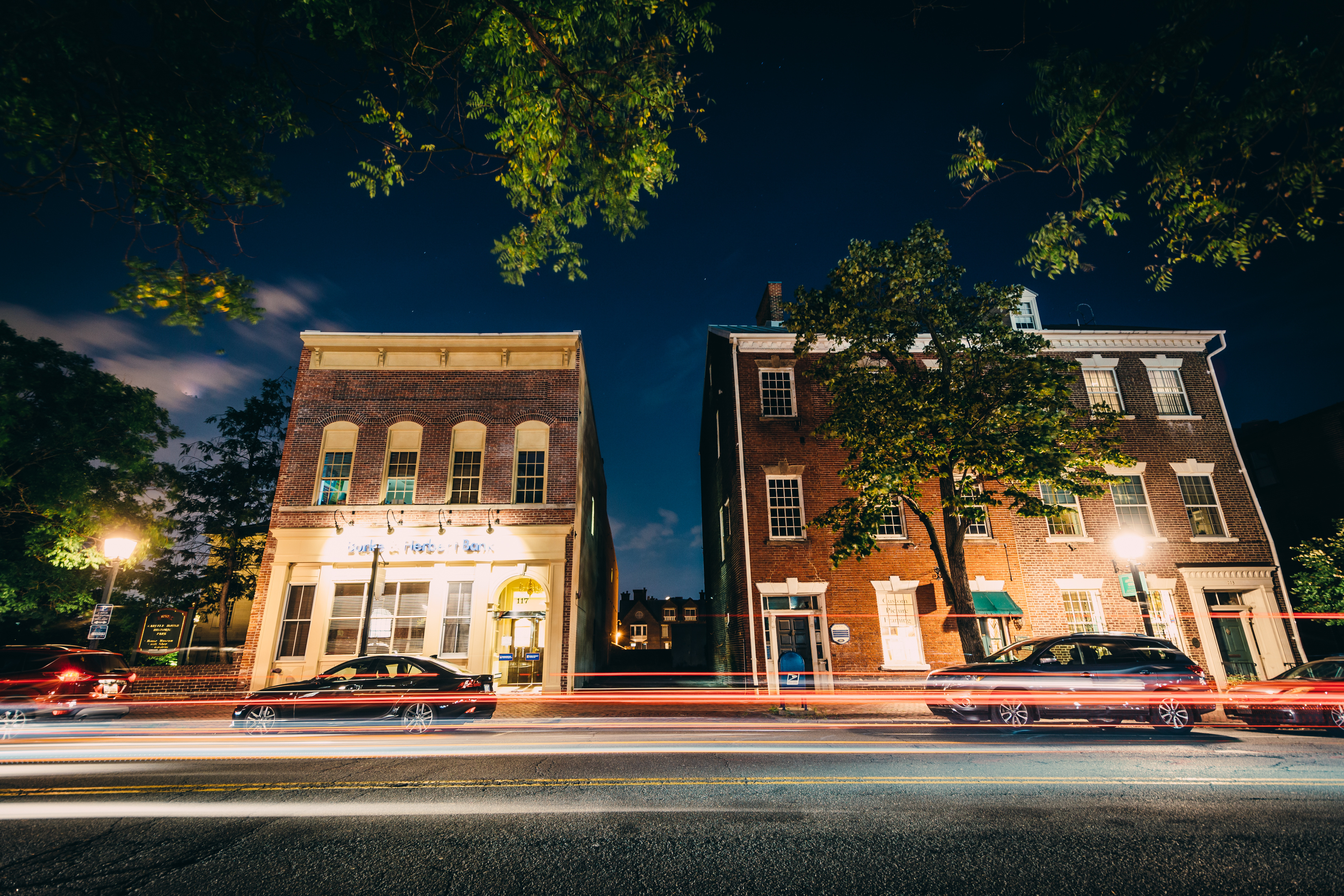 Buildings on Fairfax Street at night, in the Old Town of Alexandria, VA