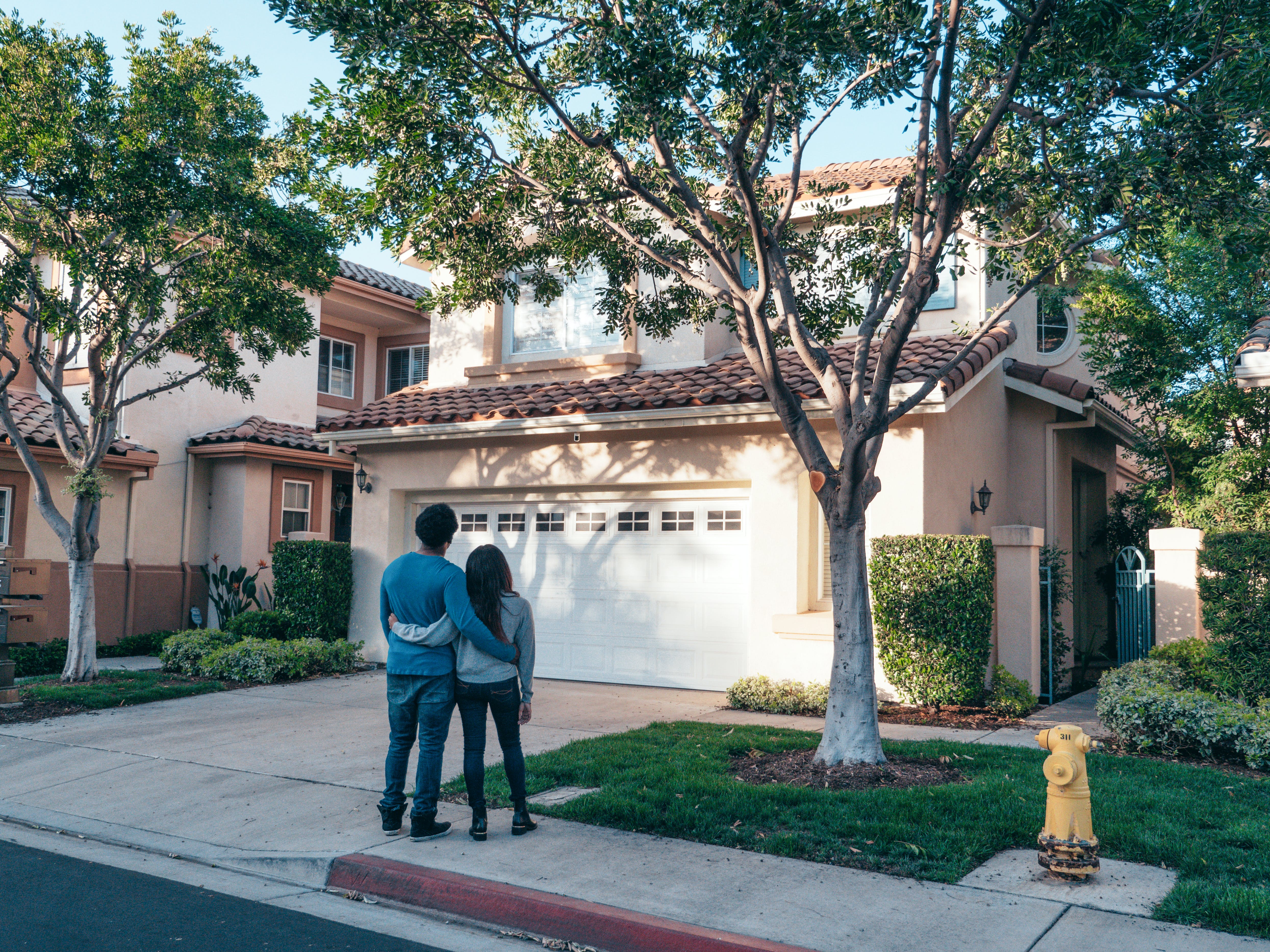 couple observing their house