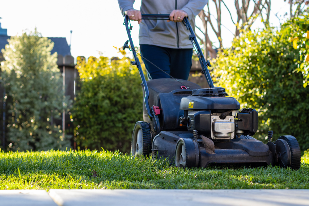 A person mowing lawn