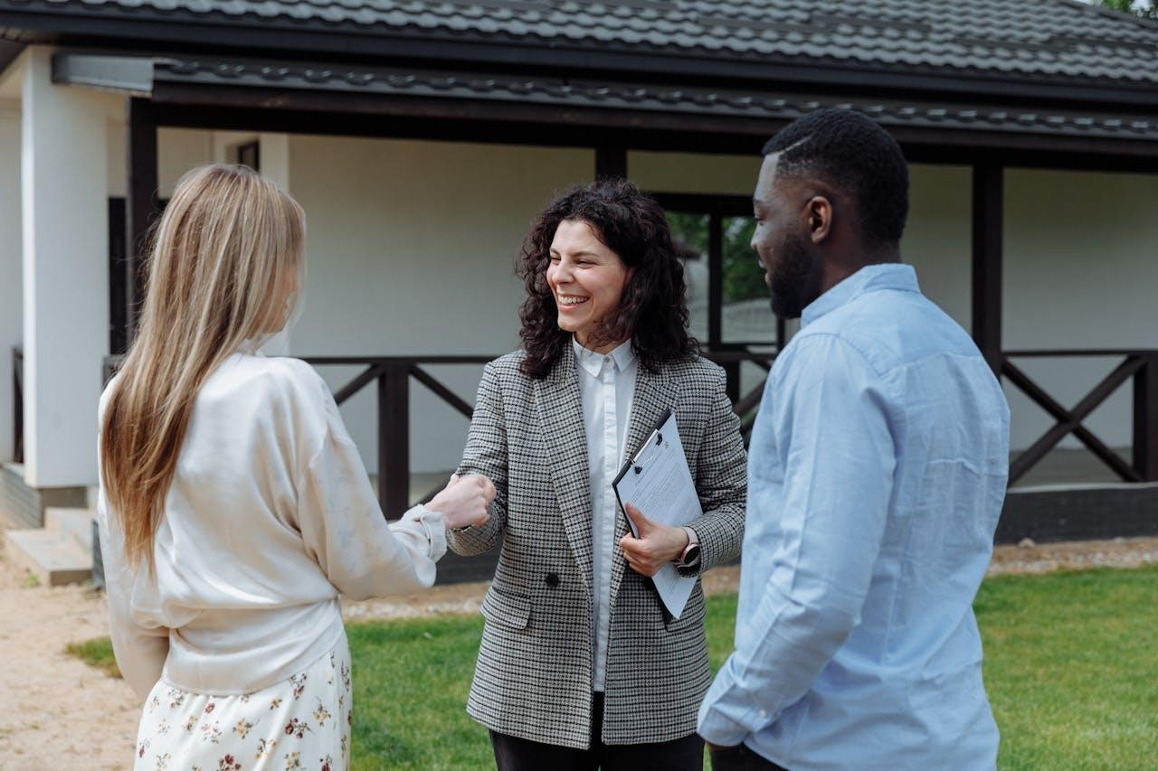 couple meeting a real estate agent